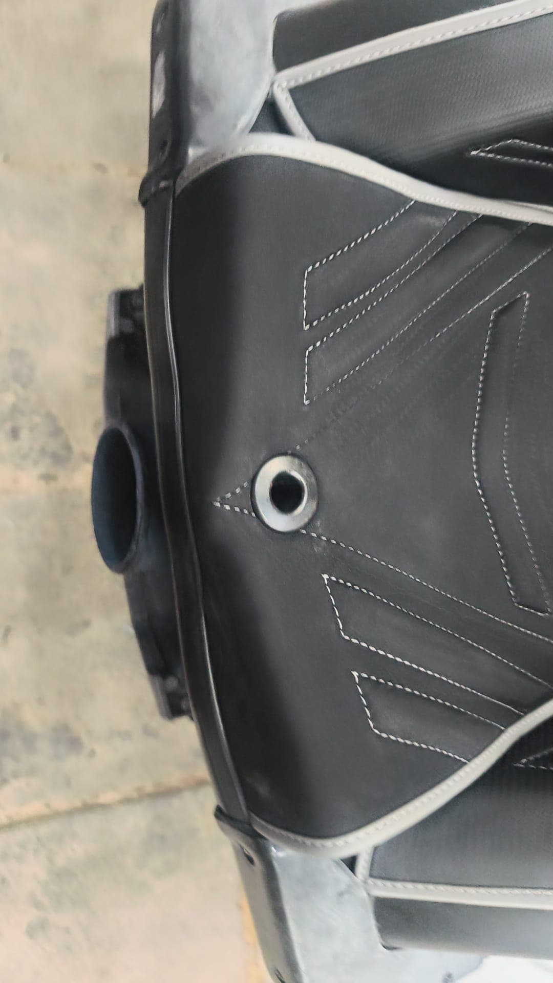 Close-up of contrast stitching on a black custom jet ski seat by Shakeel Marine in Kuwait